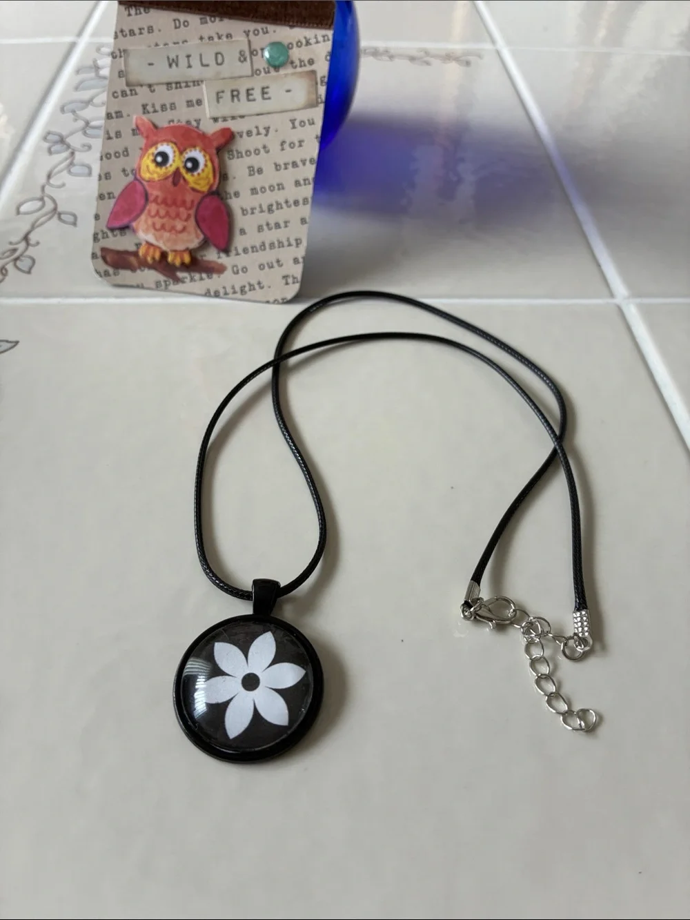 Hand Crafted Black Pendant Necklace with White Flower Motif